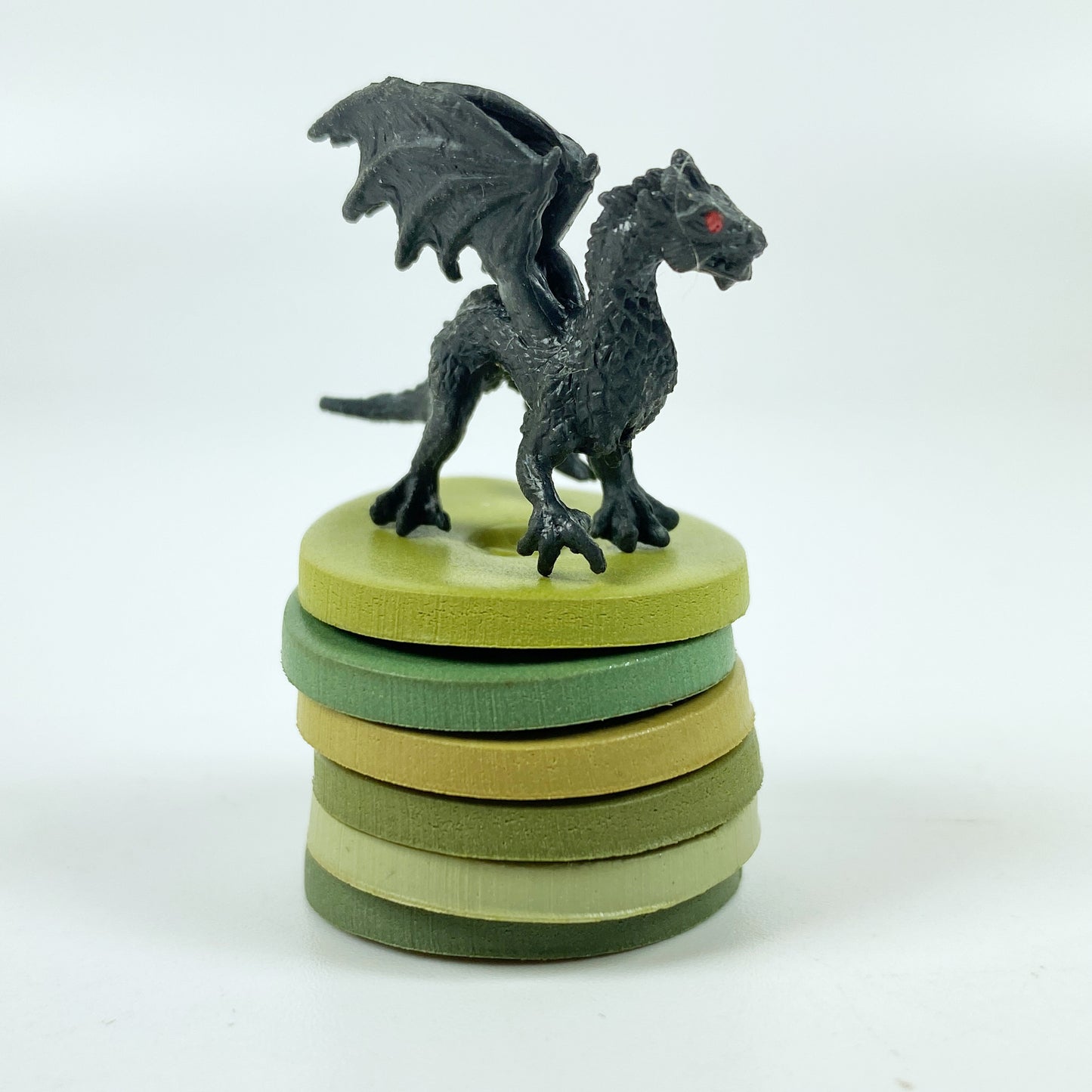Winter Garden Palette Polymer Clay Color Mixing Tutorial color sample discs in a stack with a tiny black dragon