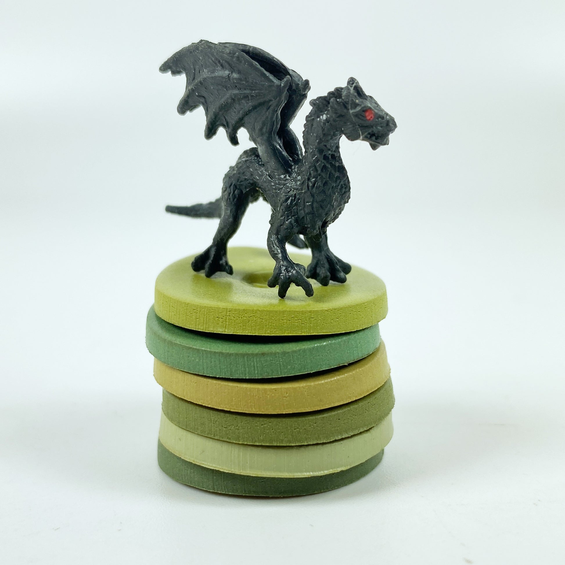 Winter Garden Palette Polymer Clay Color Mixing Tutorial color sample discs in a stack with a tiny black dragon
