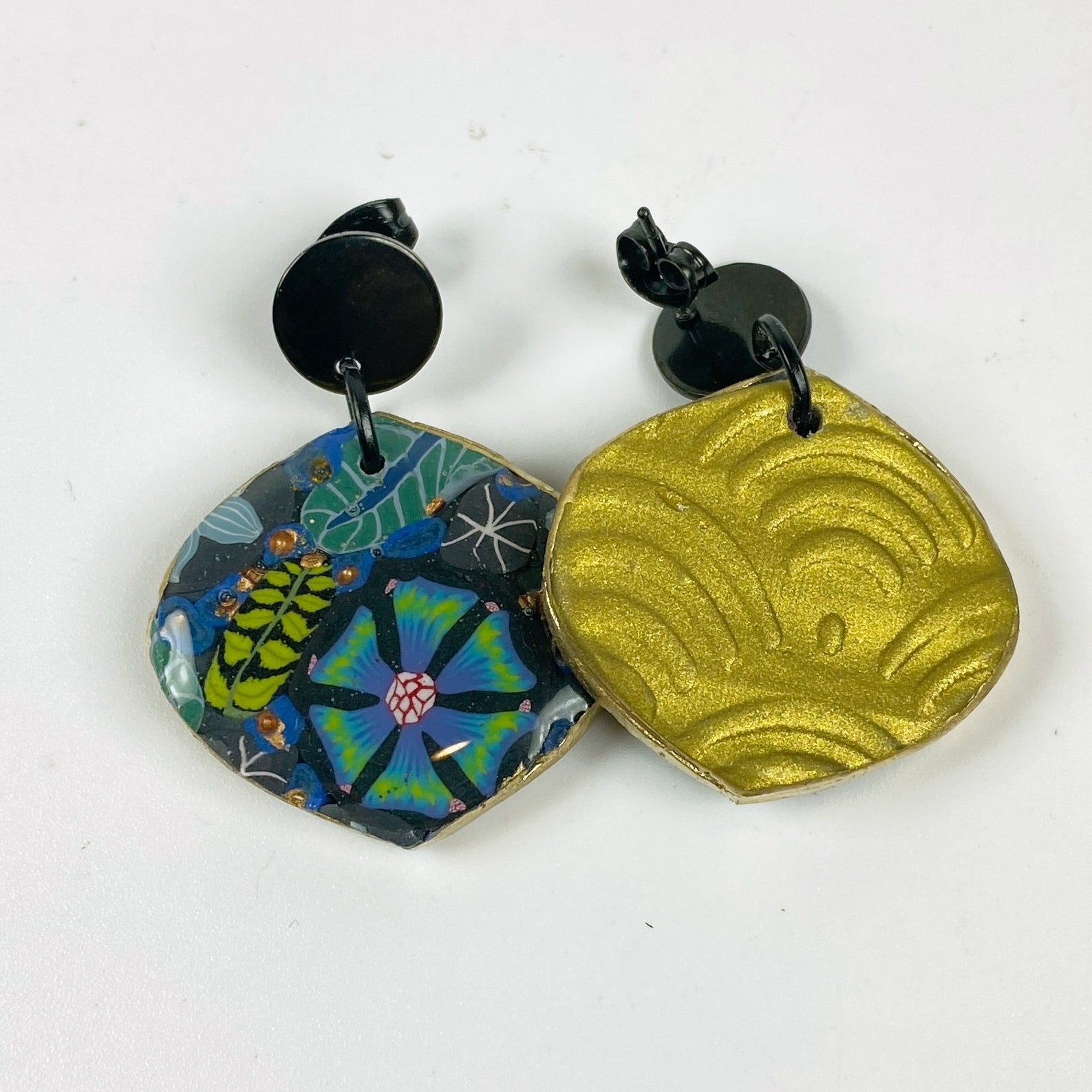 Blue Blossom Handmade Polymer Clay Dangle Earrrings showing the embossed design in gold on the back