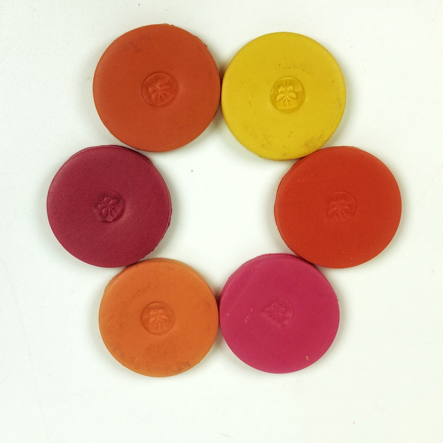 Discs of Polymer Clay in all 6 brick colors of this palette, arranged in a ring.