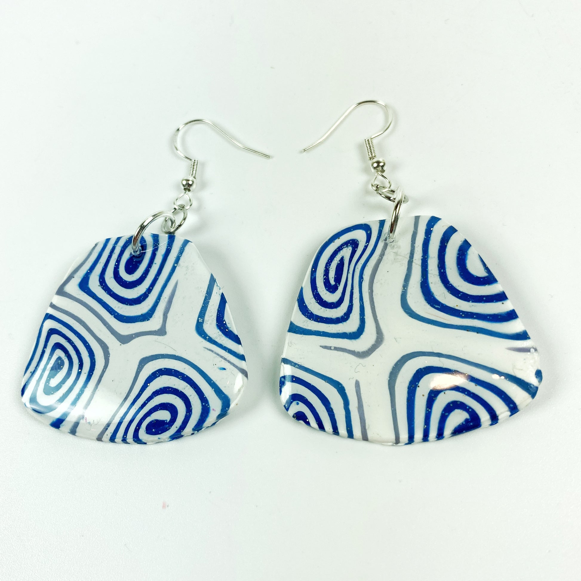 Swirling Cosmos Blue Polymer Clay Handmade Dangle Earrings front view