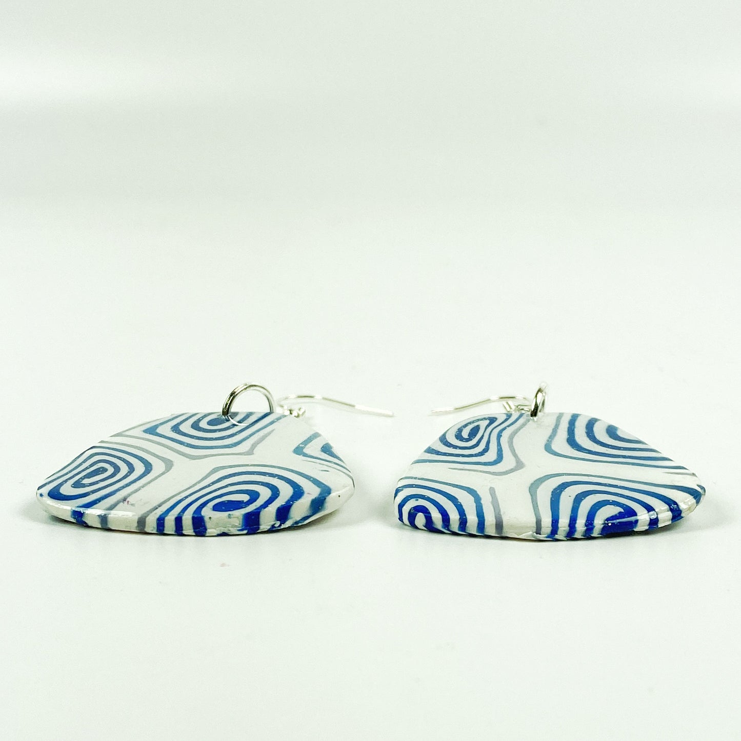 Swirling Cosmos Blue Polymer Clay Handmade Dangle Earrings side view