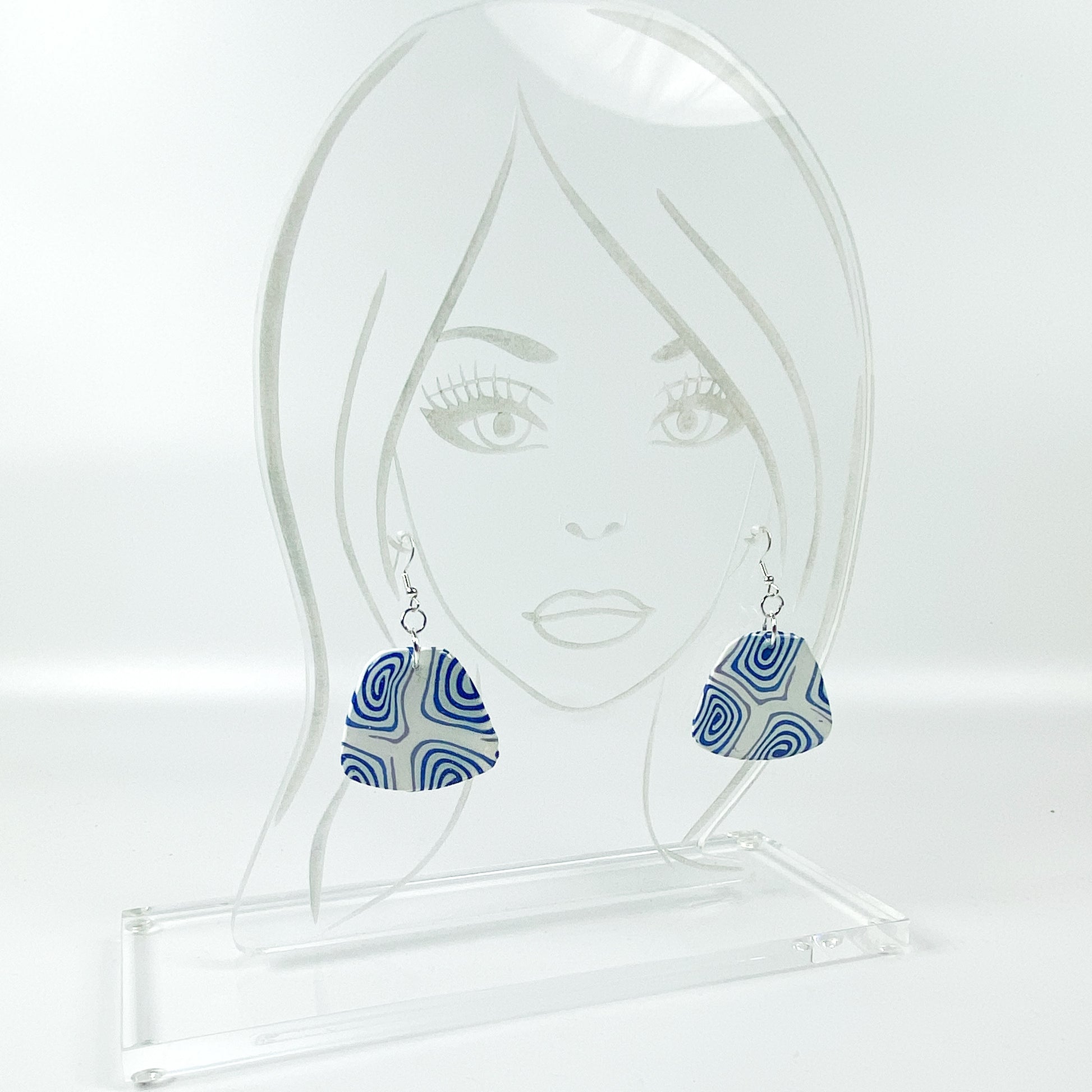 Swirling Cosmos Blue Polymer Clay Handmade Dangle Earrings on acrylic display head