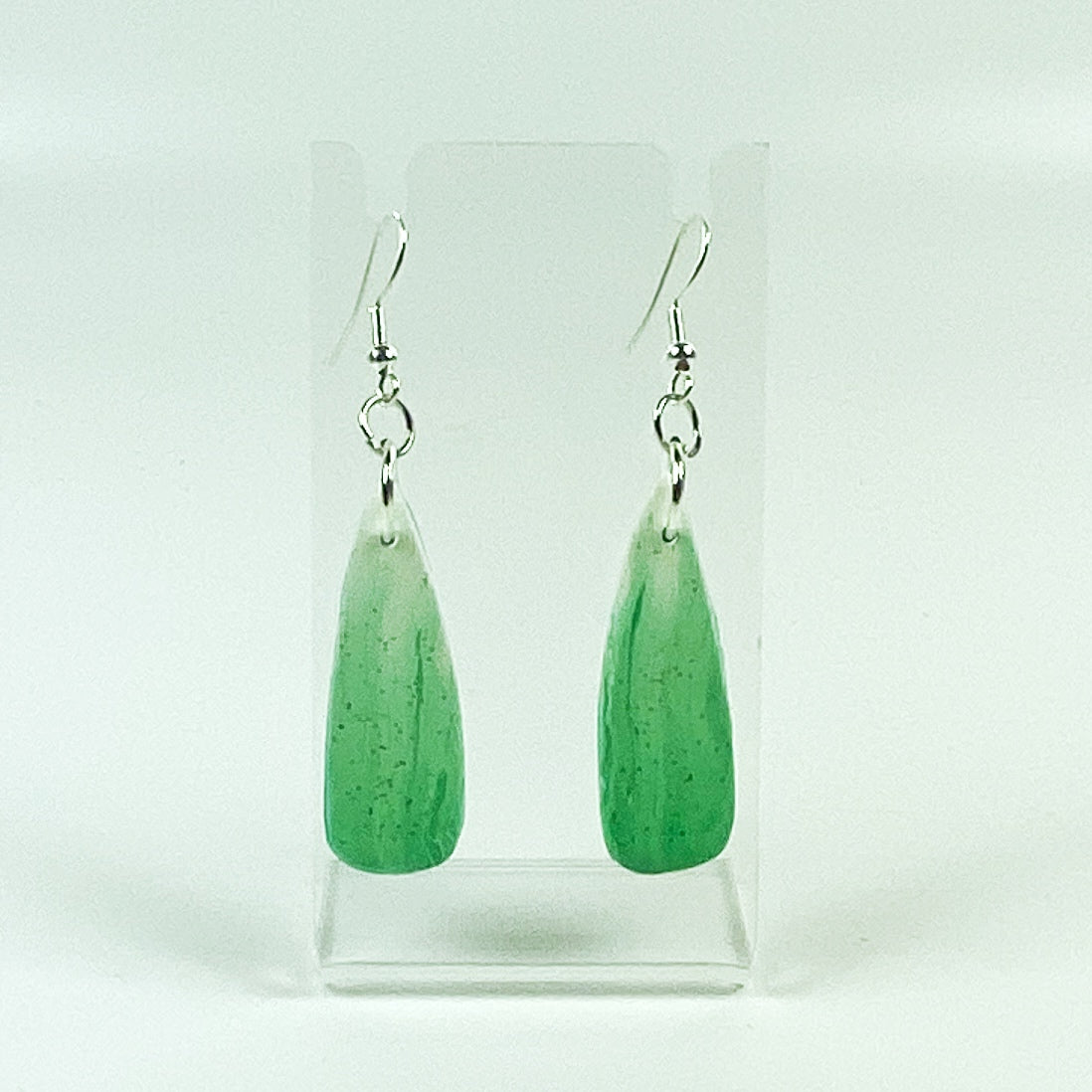 Green Aurora Polymer Clay Handmade Dangle Earrings on small acrylic display stand