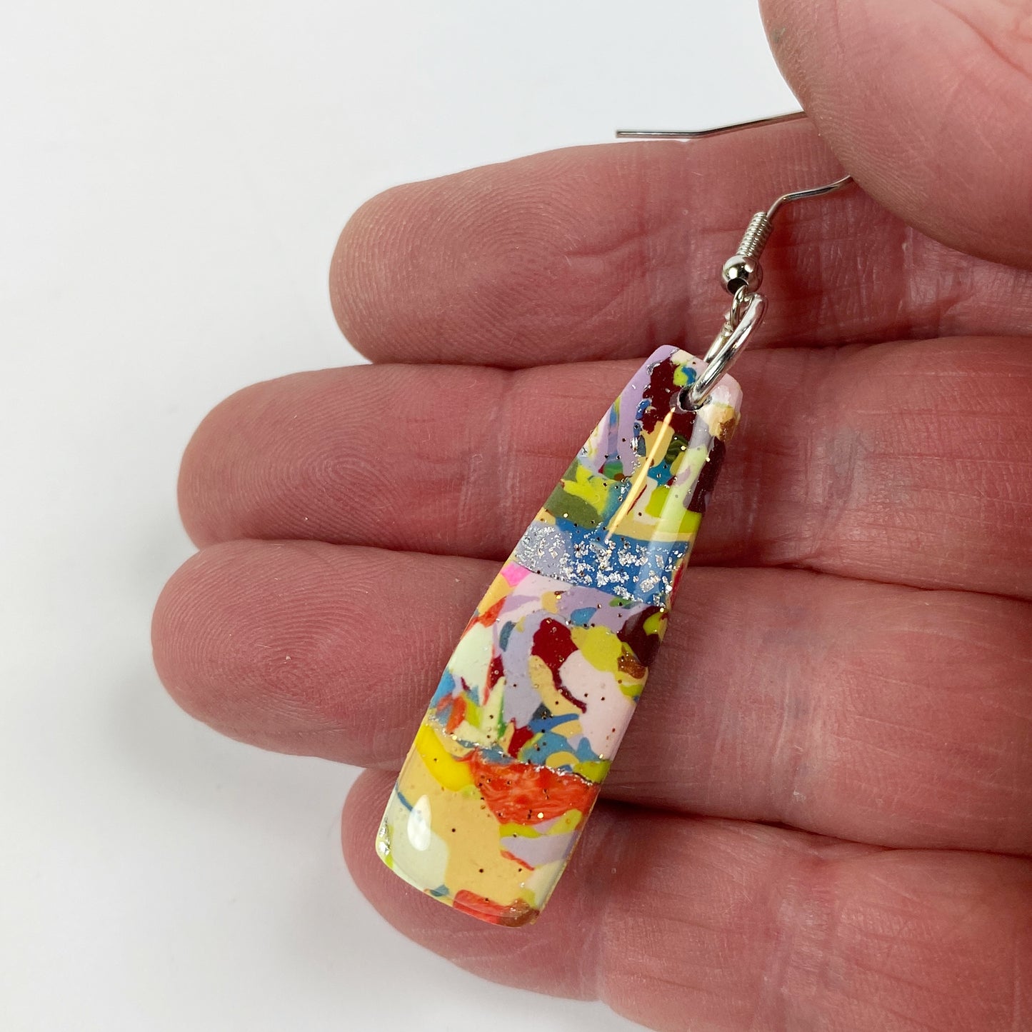 Meadow Breeze Polymer Clay Handmade Dangle Earrings hand held for size reference