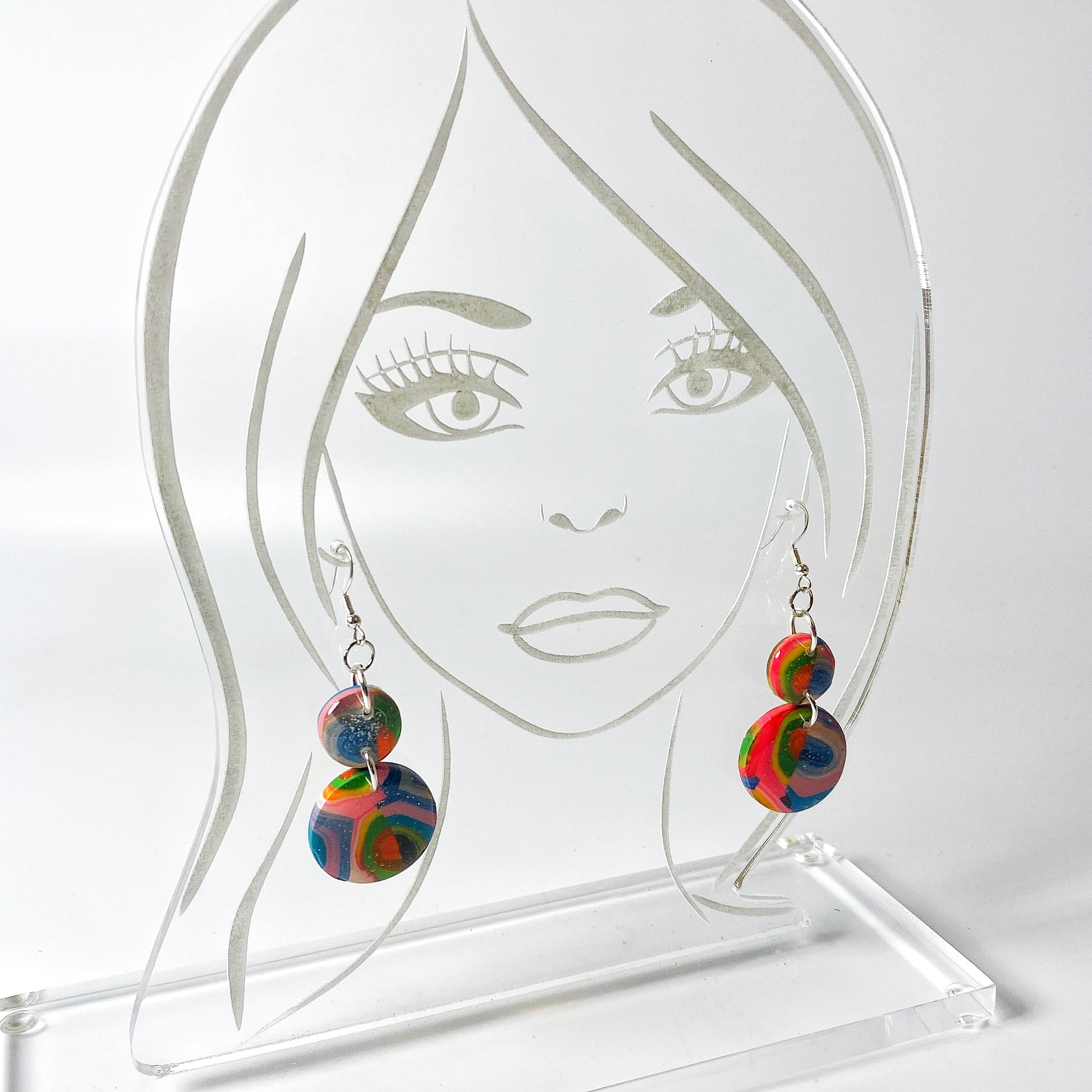 Double Kaleidoscope Multicolor Polymer Clay Dangle Earrings on acrylic display head