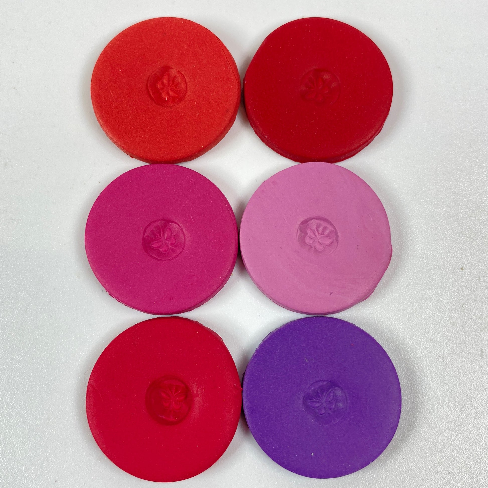 Discs of Polymer Clay in all 6 pink and purple colors of this palette, arranged 2 wide and 3 tall.